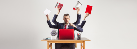 A man with man hands at a desk